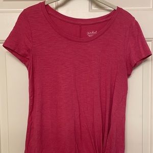 Pink shirt with ruffled design on the bottom